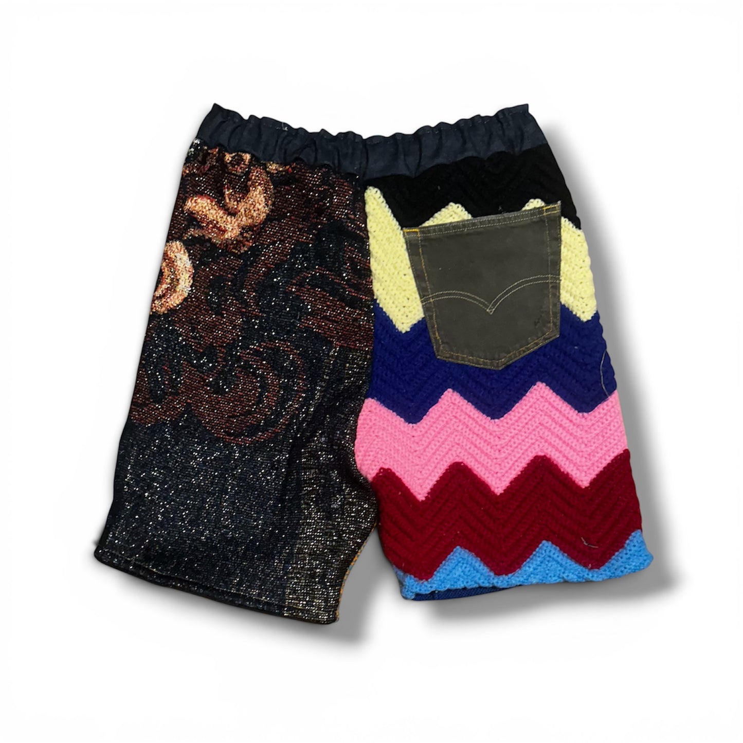 Shorts with a patterned front pocket on a white background